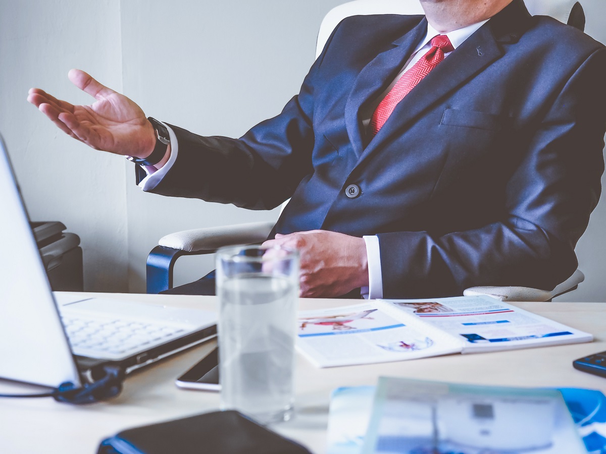 man at his office desk