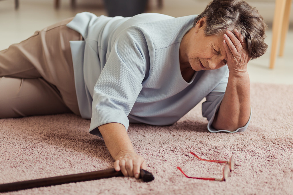 woman with cane fallen