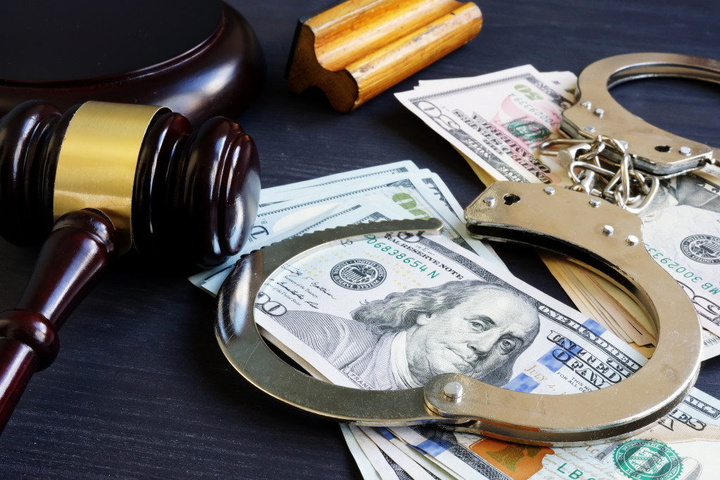 money, gavel, and handcuffs