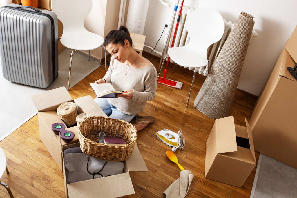 A woman unpacking after moving to a new house