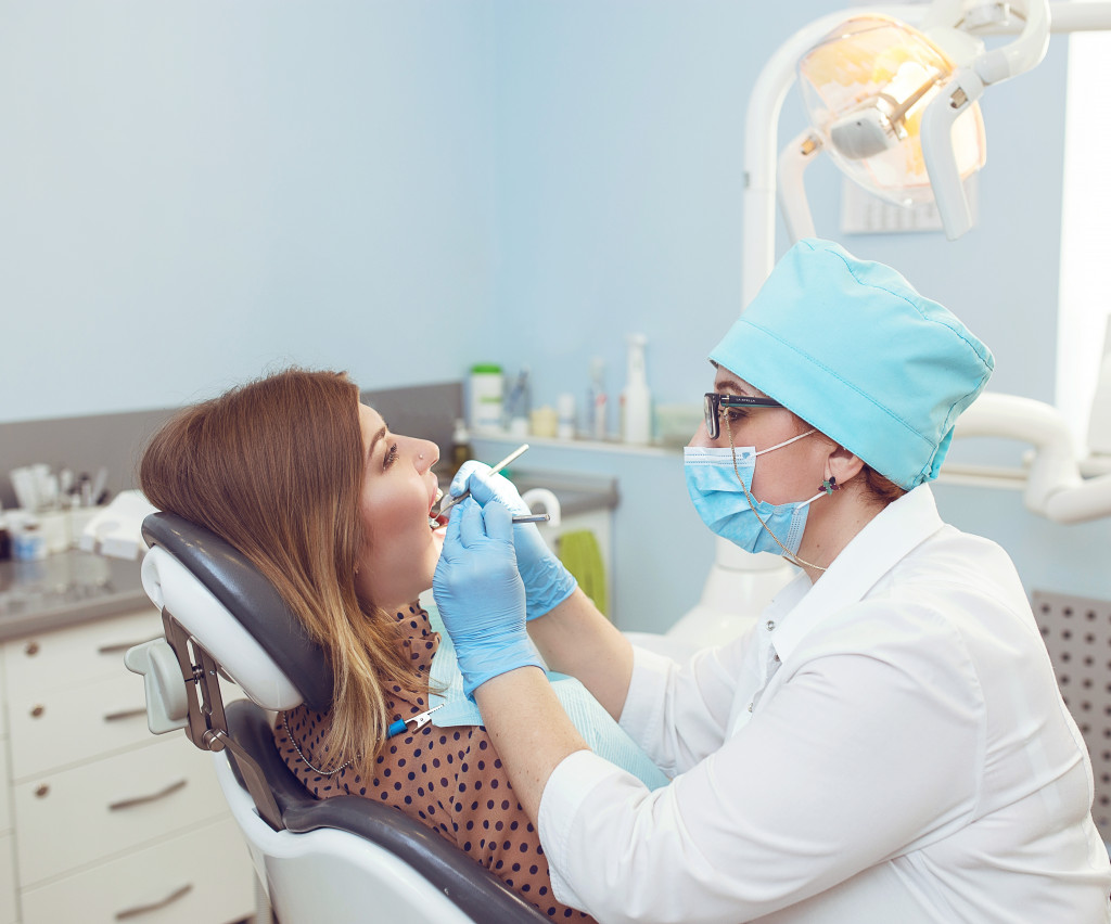 dentists checking patients oral health