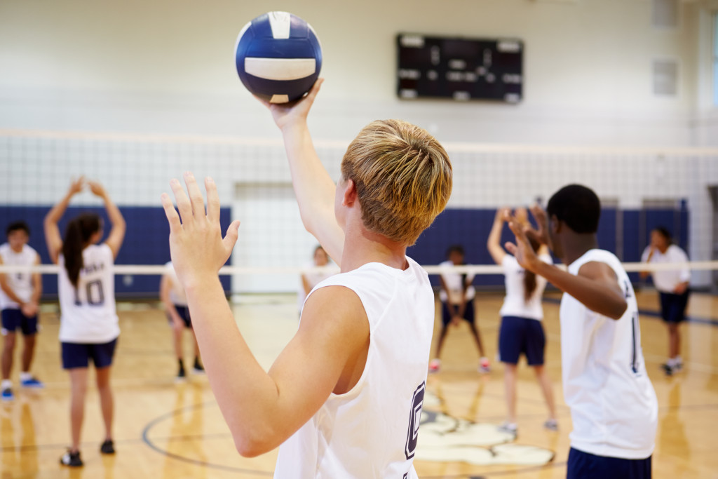 High school volleyball match in school gym