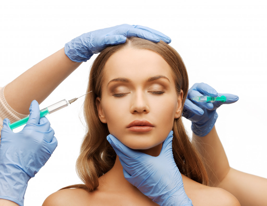 A woman undergoing a facial cosmetic procedure