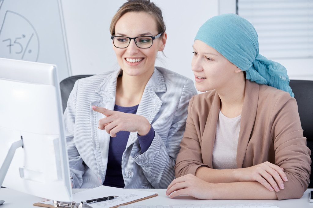 Teen girl talking to doctor after her cancer screening 