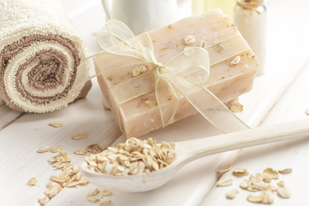 oatmeal soap wrapped in ribbon with oatmeal as decor