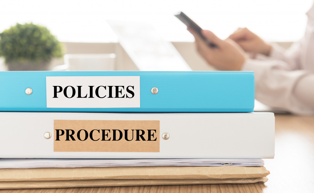 policies and procedures document on desk in meeting room