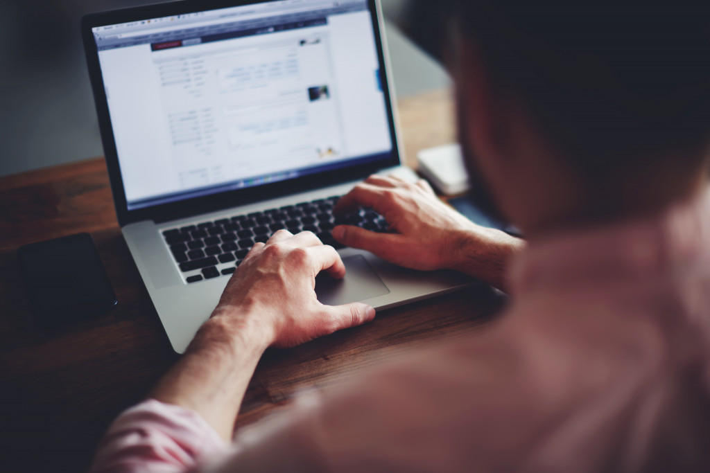 business man hands busy using laptop