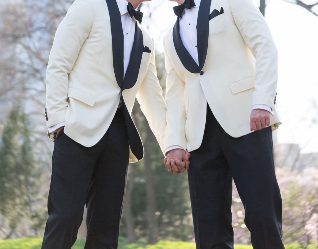 A couple wearing matching tuxedos