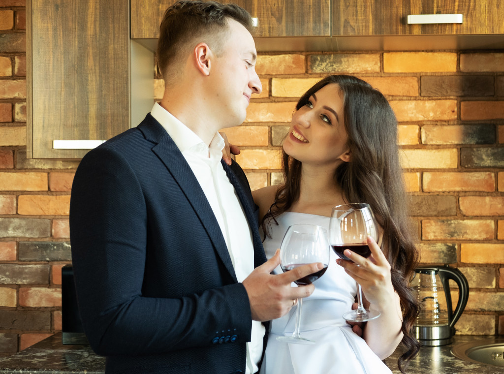 Newlyweds drinking wine