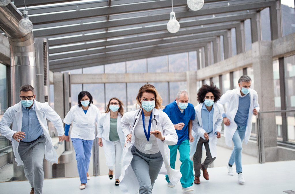 group of doctors and nurses running