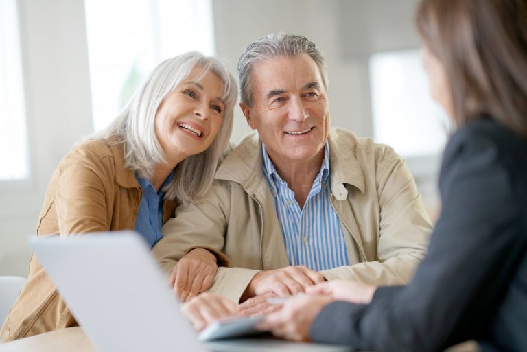 senior couple taking counsel about estate planning