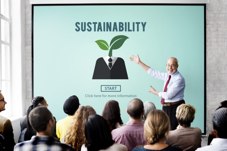 a man giving lecture in front of people about sustainability