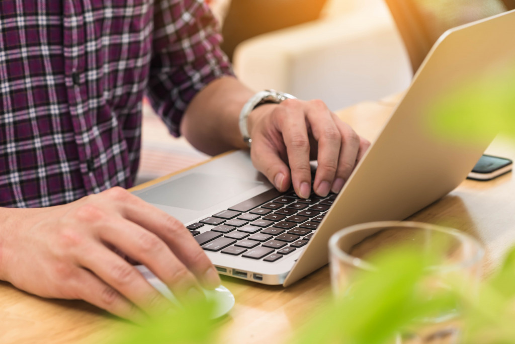 A person using a laptop at home