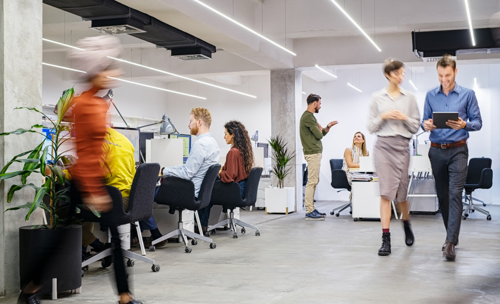 employees blurred in a modern office showing daily operations