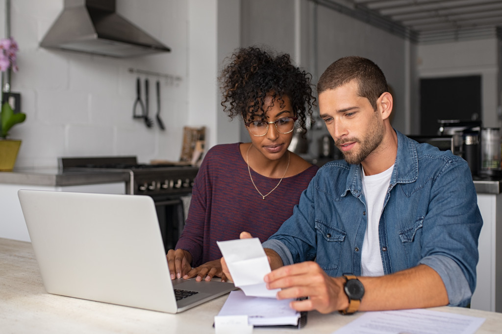 couple at home making budget