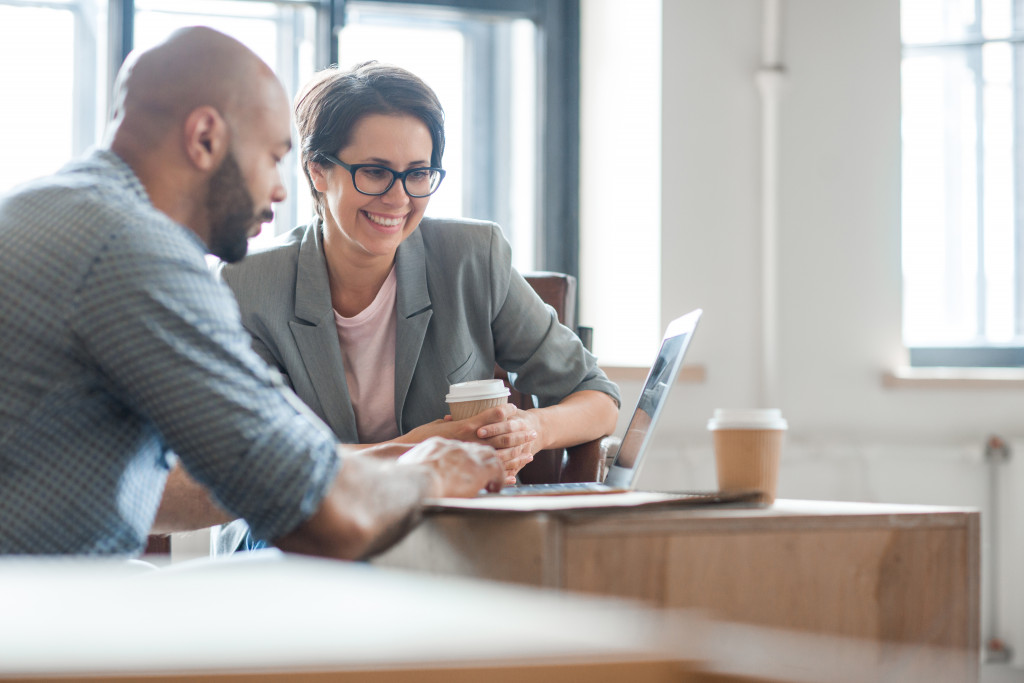 Two business owners connecting with each other over a cup of coffee.