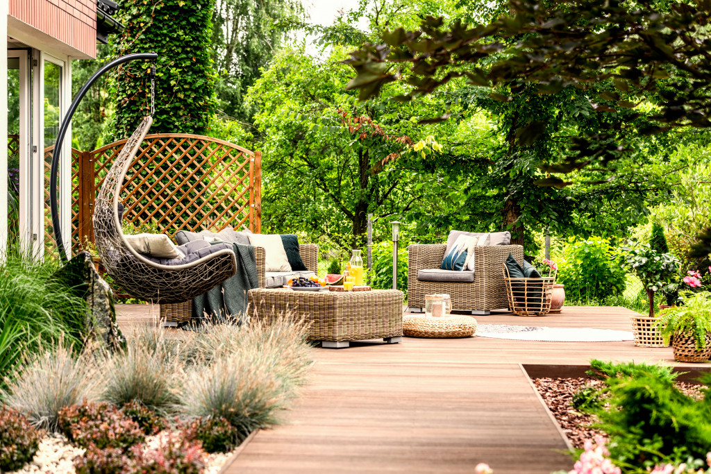 An outdoor living space with furniture and a swing