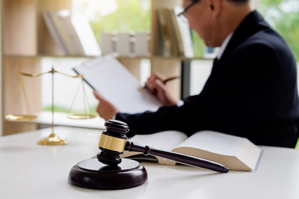 lawyer in office signing a document