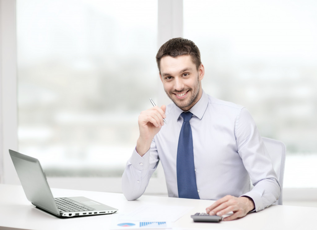 happy smiling employer in his office